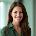 Portrait of a smiling female UX designer with a warm, approachable expression.